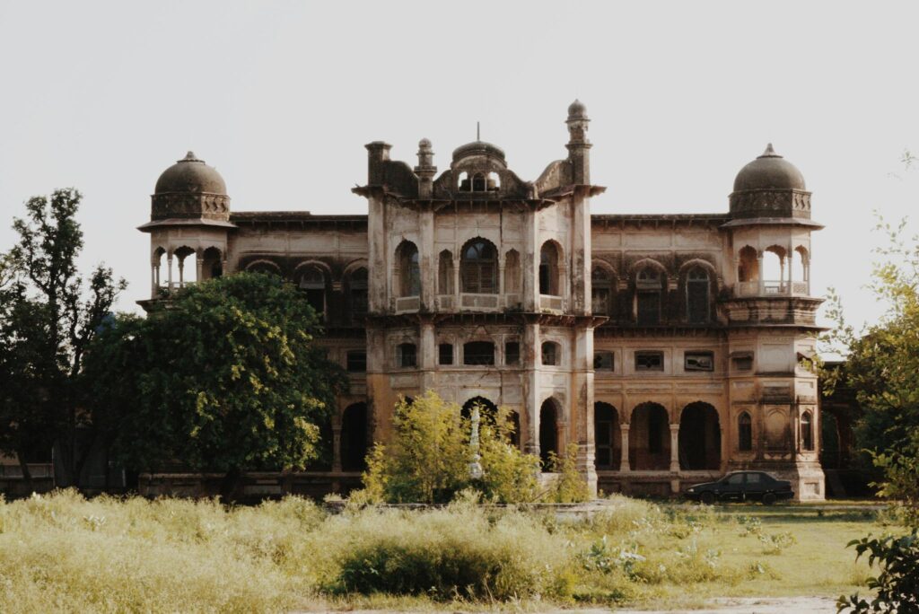 Explore the ancient Mughal architecture in Bassi Pathana, Punjab, surrounded by lush greenery.